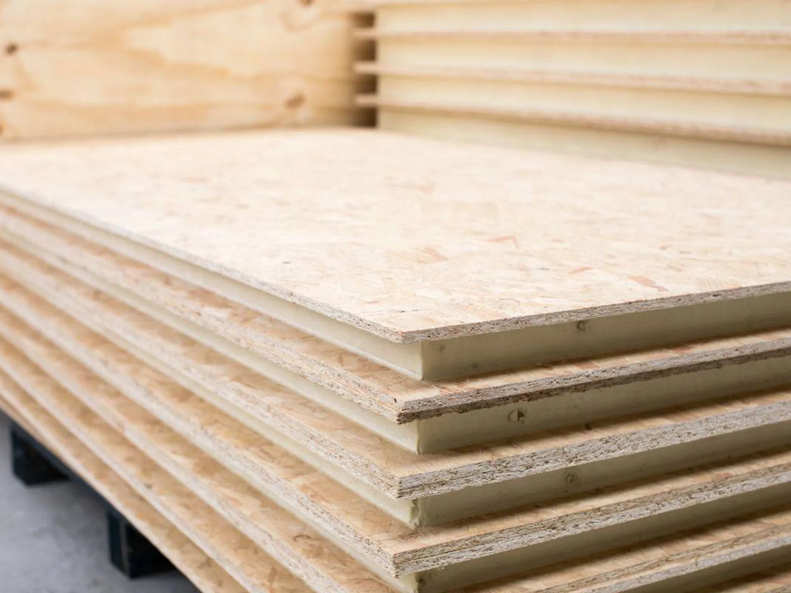 Stack of standard SIP panels with 11mm OSB facings and insulated core
